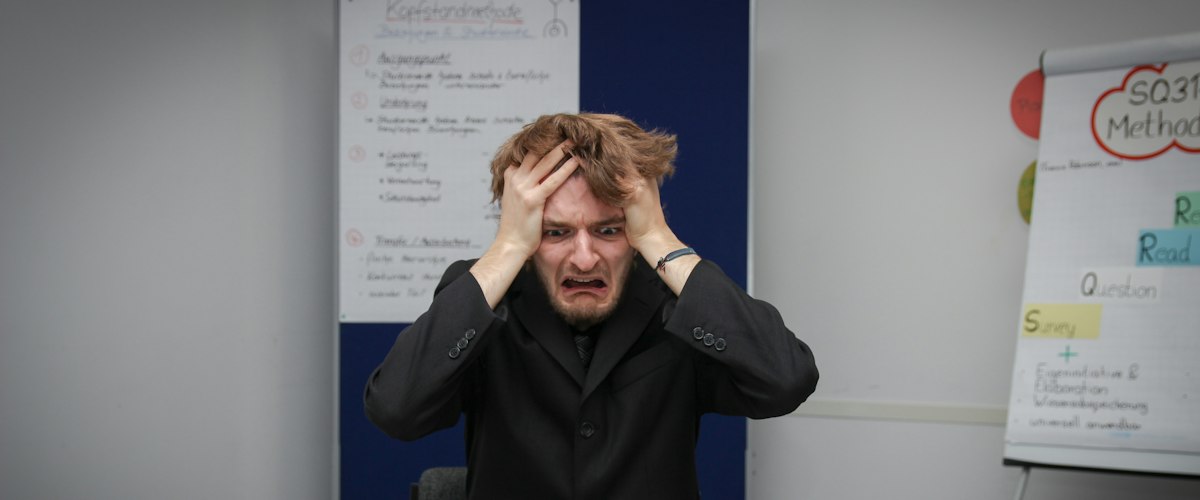A man sitting in front of a laptop computer