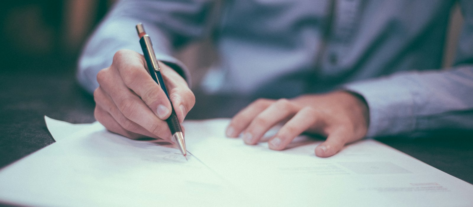 Man writing on paper