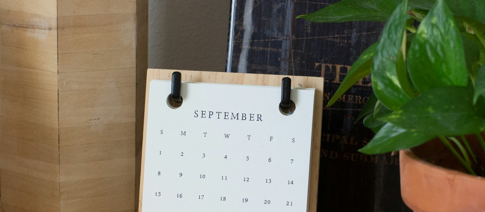 White braille paper on brown wooden table
